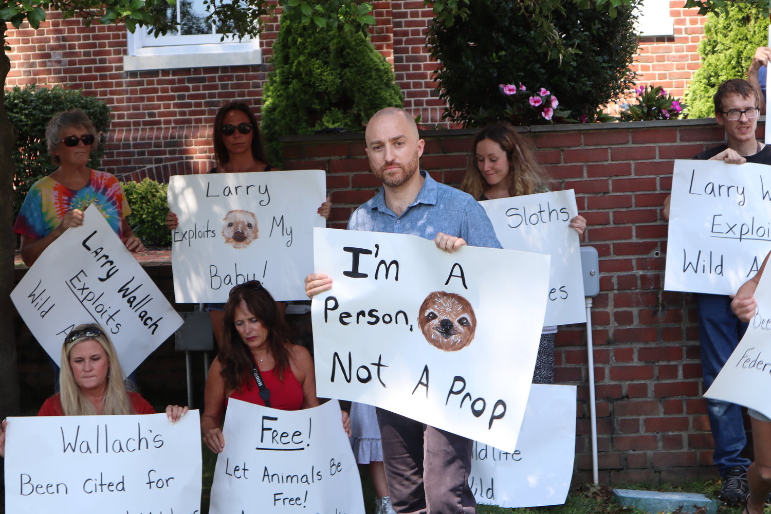John Di Leonardo, founder and president of Humane Long Island, protests Sloth Encounters in front of the Town of Islip building.